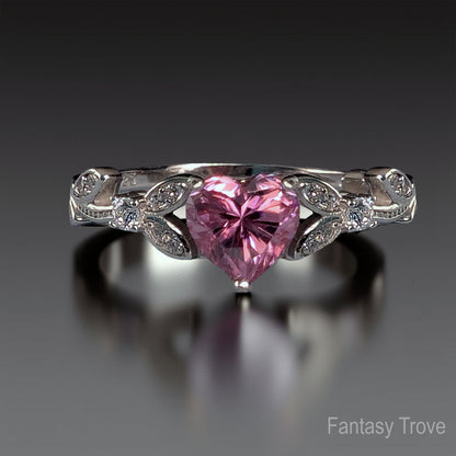 Ring with a pink heart-shaped gemstone on a dark background