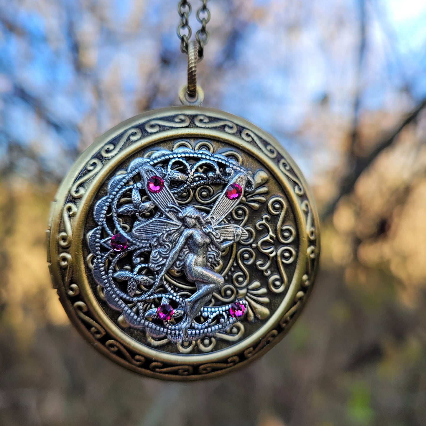 Beautiful large fairy locket necklace for those who love fantasy jewelry.