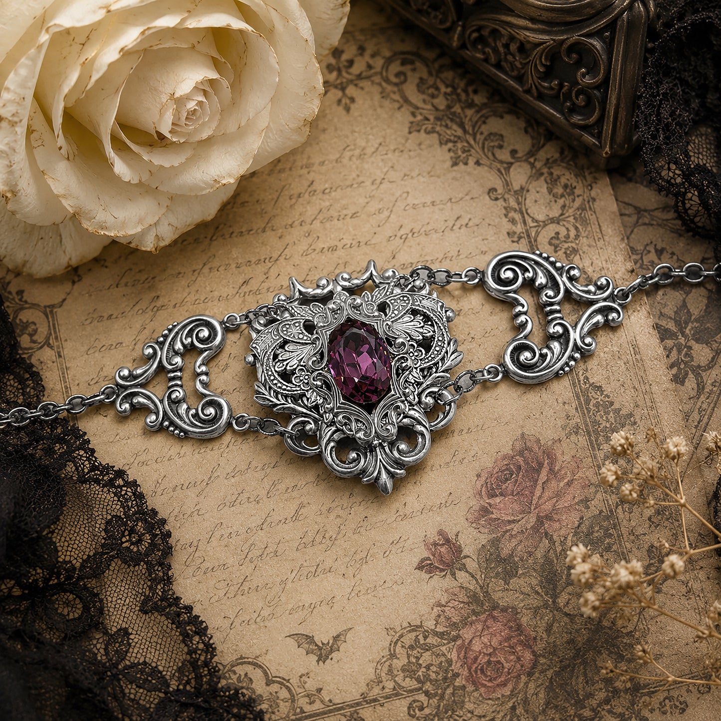 Ornate sterling silver gothic bracelet with a purple Amethyst gemstone on an antique paper background.