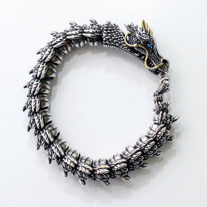 Silver dragon bracelet on a white background