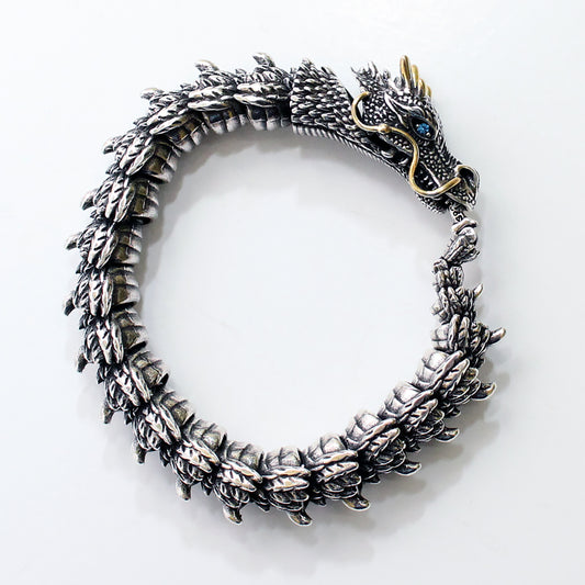 Silver dragon bracelet on a white background