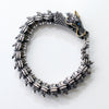 Silver dragon bracelet on a white background