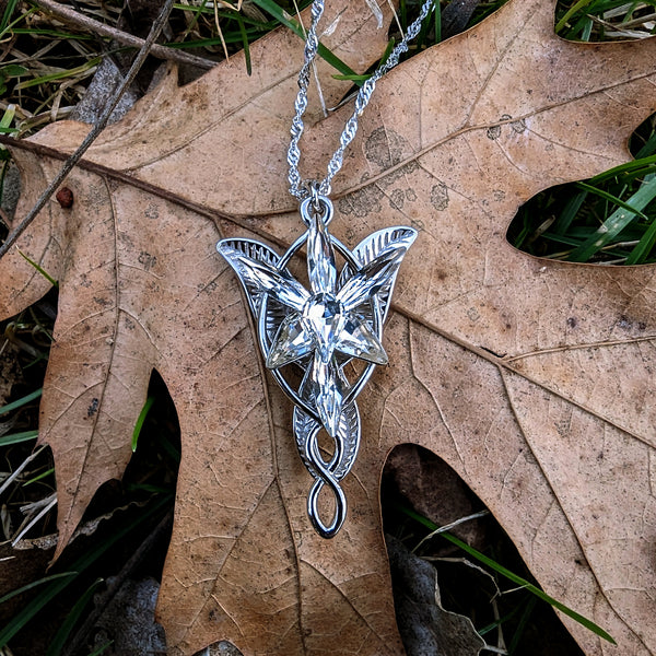 Sterling silver Arwen Evenstar necklace on velvet background – LOTR inspired jewelry