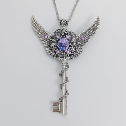 Fantasy floral sterling silver key necklace with wings made with Swarovski crystals.  Fairy jewelry.