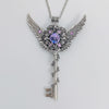 Fantasy floral sterling silver key necklace with wings made with Swarovski crystals.  Fairy jewelry.