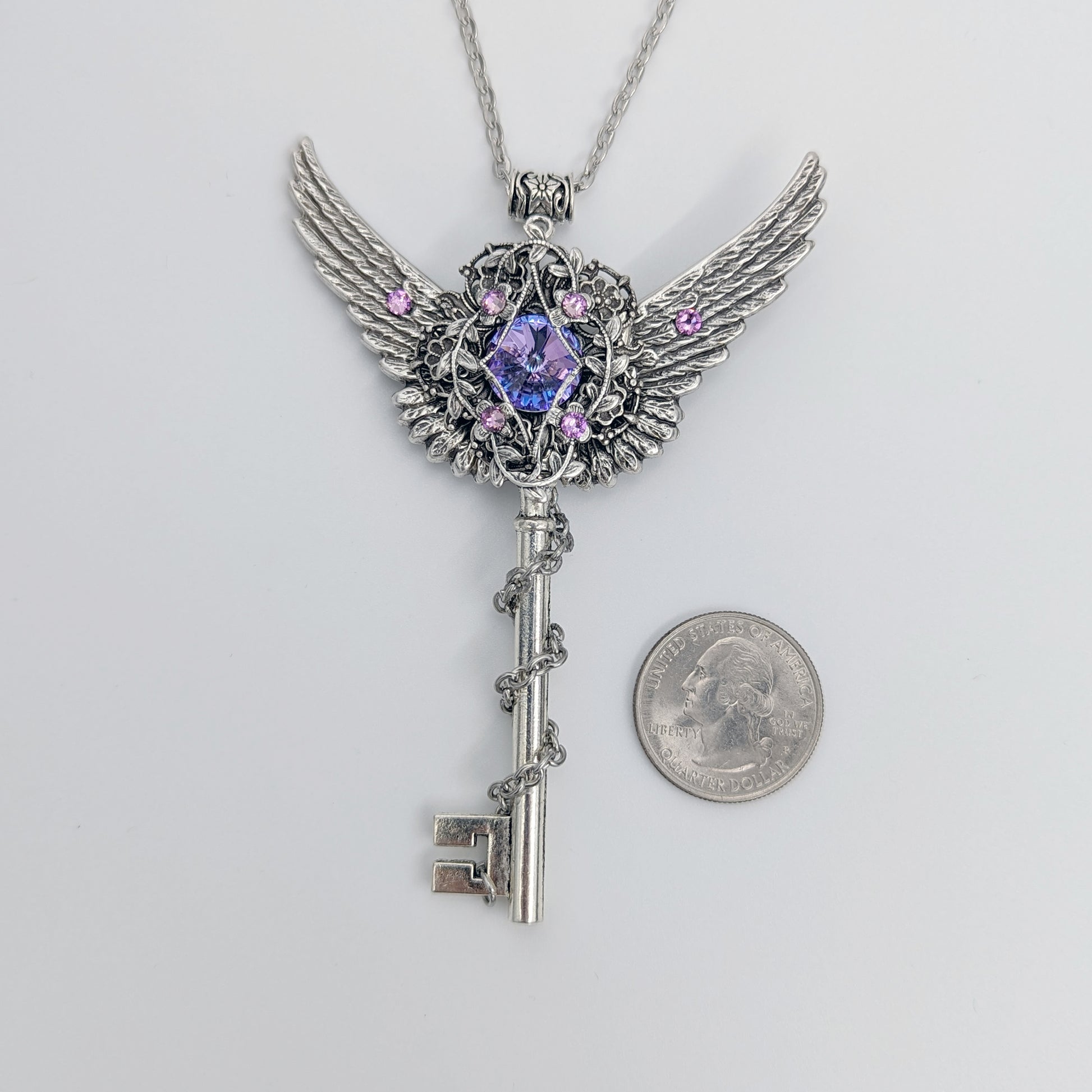 Fantasy floral sterling silver key necklace with wings made with Swarovski crystals.  Fairy jewelry.