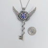 Fantasy floral sterling silver key necklace with wings made with Swarovski crystals.  Fairy jewelry.