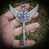 Fantasy floral sterling silver key necklace with wings made with Swarovski crystals.  Fairy jewelry. Magical Jewelry