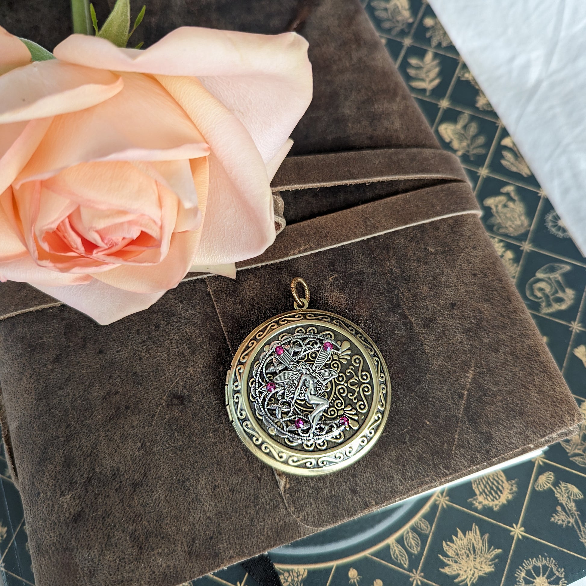 Beautiful large fairy locket necklace for those who love fantasy jewelry.