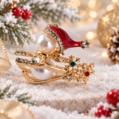 Snowman on sled holiday Christmas brooch