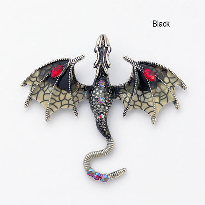 Black Dragon-shaped brooch pendant with intricate design and gemstones on a white background. Dragon fantasy jewelry
