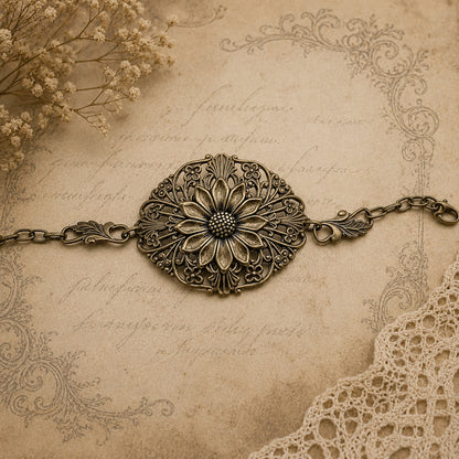 Decorative bronze sunflower bracelet on an ornate, vintage-style background with lace and flowers.