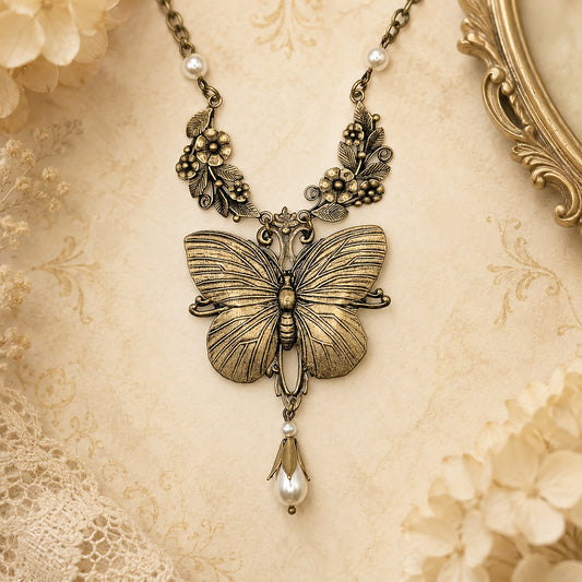 Brass butterfly pendant necklace with pearls and floral detail.  Fairycore Cottagecore jewelry