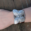 silver Butterfly bracelet on a brown leather strap