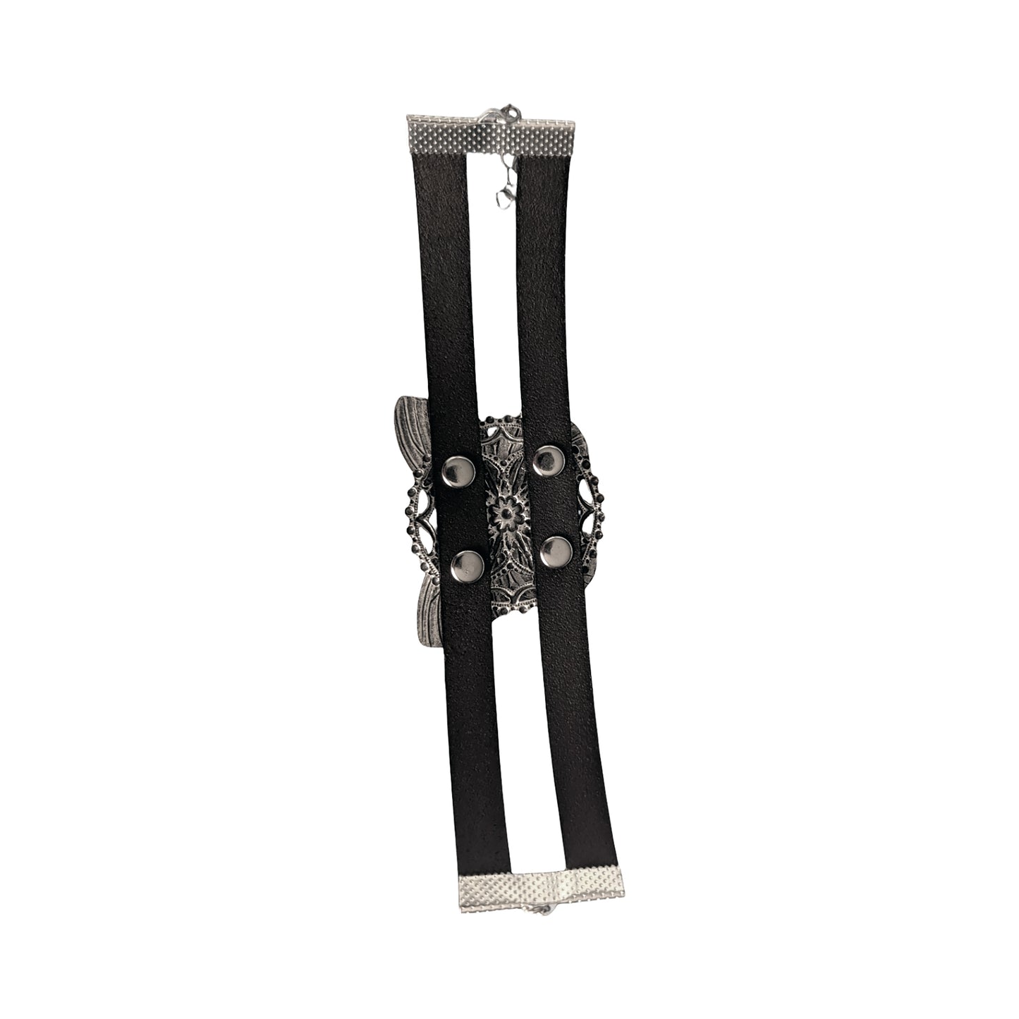 the back side of a silver butterfly bracelet, showing silver rivets and leather straps against a white background