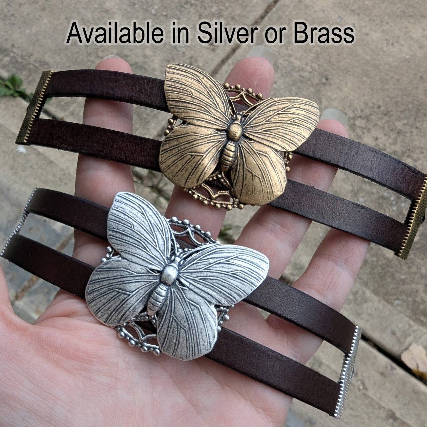 Butterfly-shaped bracelets in silver and brass held in a hand with text 'Available in Silver or Brass'.