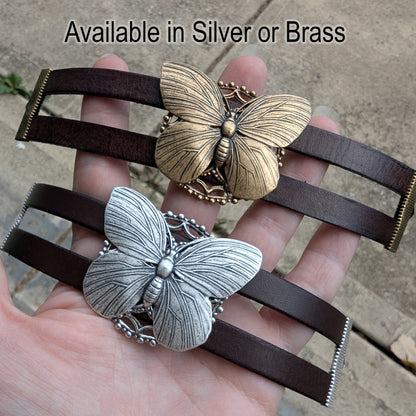 Butterfly-shaped bracelets in silver and brass held in a hand with text 'Available in Silver or Brass'.