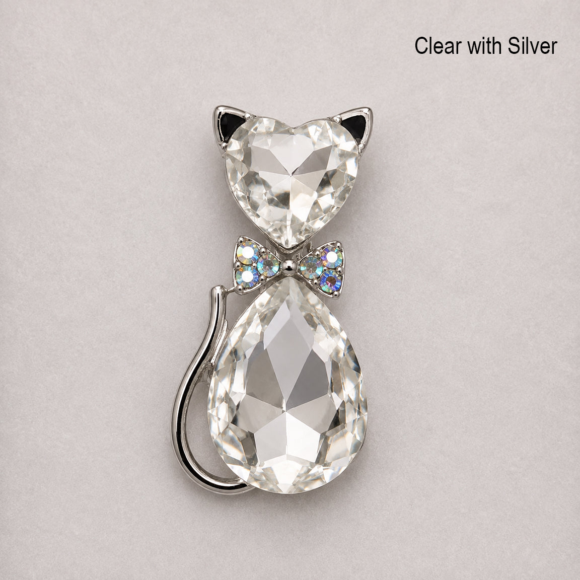 Clear crystal cat-shaped pendant with silver accents on a light gray background