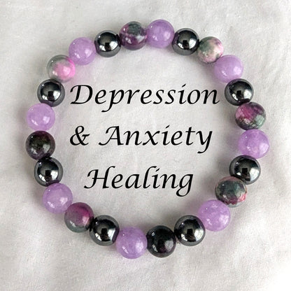 Bracelet with violet purple, Persian Jade and black hematite beads on white background