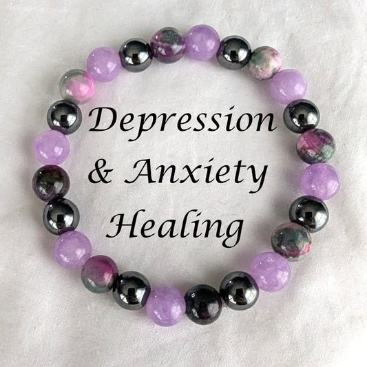 Bracelet with violet purple, Persian Jade and black hematite beads on white background