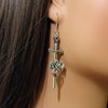 silver toned dragon on sword modeled on ear