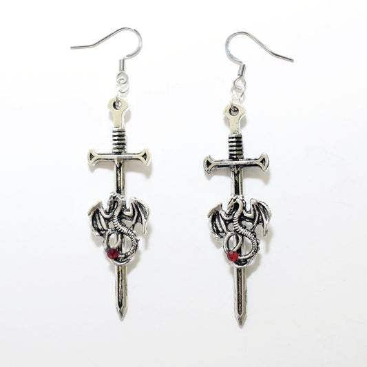 Silver sword and dragon earrings on a white background