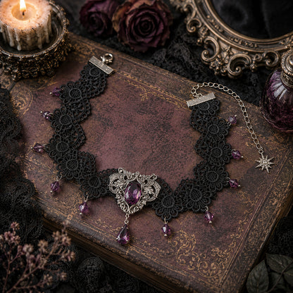 Black lace choker necklace with purple Amethyst Swarovski crystals on an old book with a candle and roses in the background