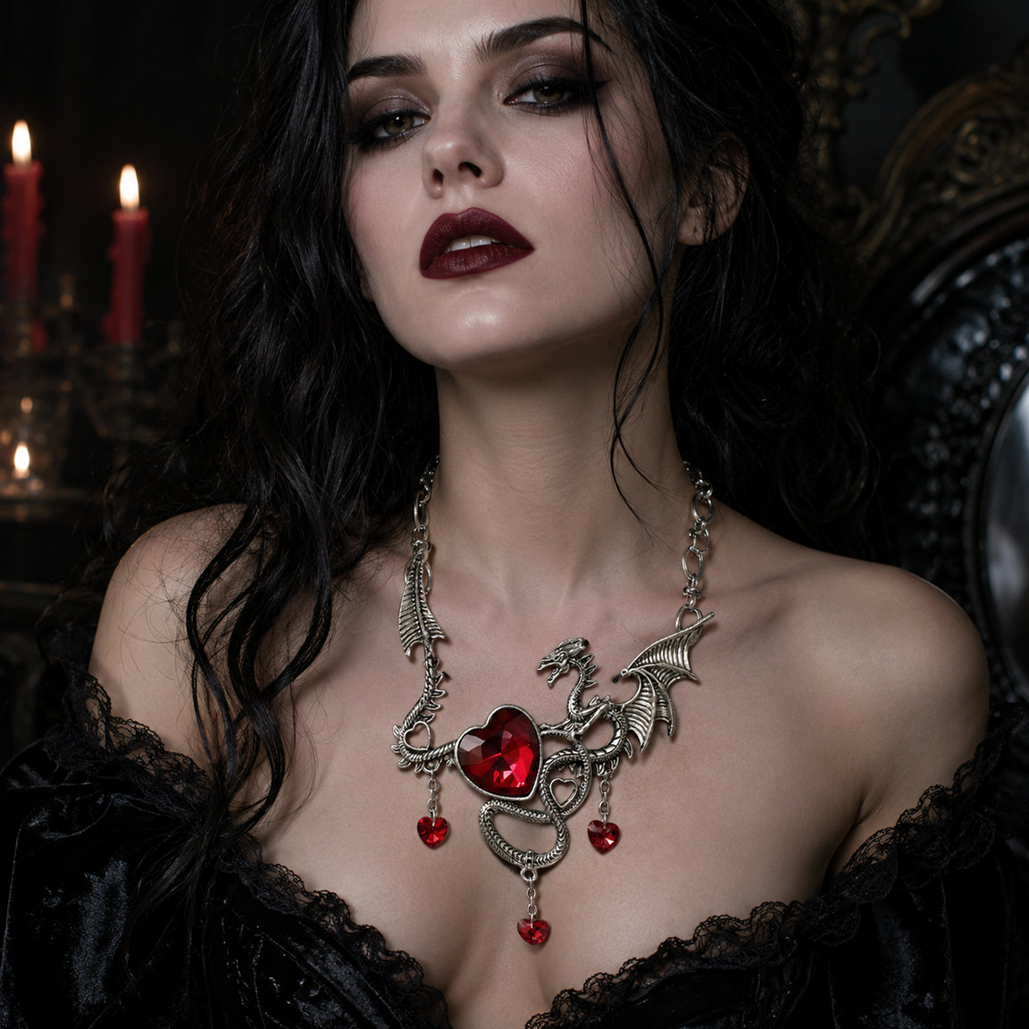 Gothic Woman wearing a dragon necklace with red heart rhinestones in a dark setting