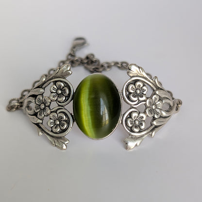 Olivine Cats Eye Sterling Silver Floral Green Glass Victorian Fairy Boho Bracelet, indoor light.