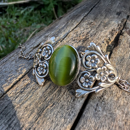 Olivine Cats Eye Sterling Silver Floral Green Glass Victorian Fairy Boho Bracelet, outside, natrural background.