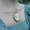 Gold framed Jesus cameo pendant necklace on model