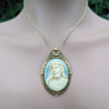 Necklace with a pendant featuring Jesus on a neutral background