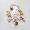 Mermaid Charm Bracelet Ocean Fantasy Jewelry with Shells, Starfish and Seahorse.