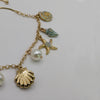 Mermaid Charm Bracelet Ocean Fantasy Jewelry with Shells, Starfish and Seahorse.