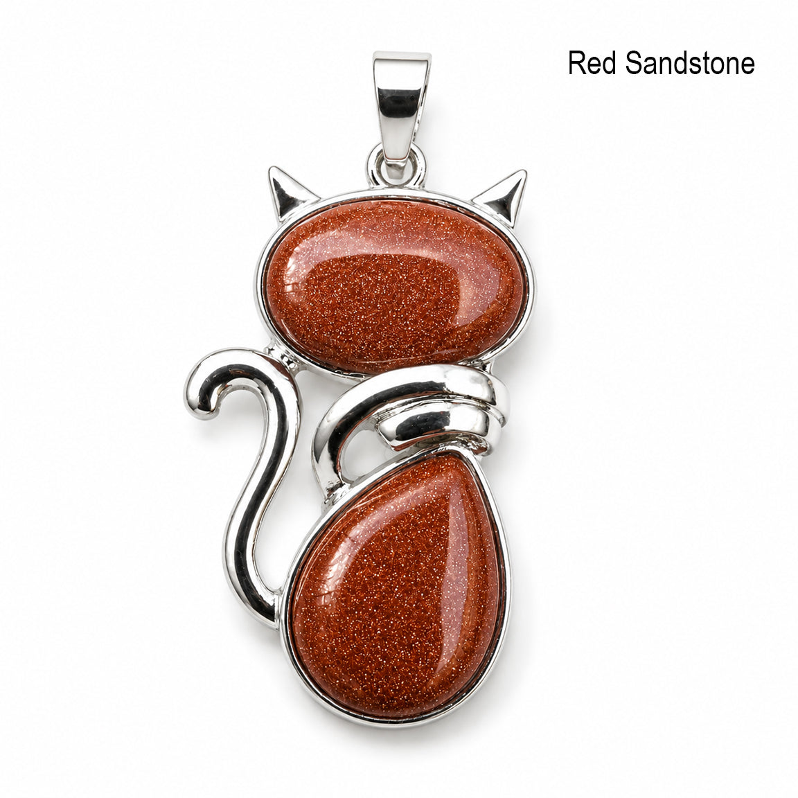 Cat-shaped pendant with red sandstone stones and silver accents on a white background