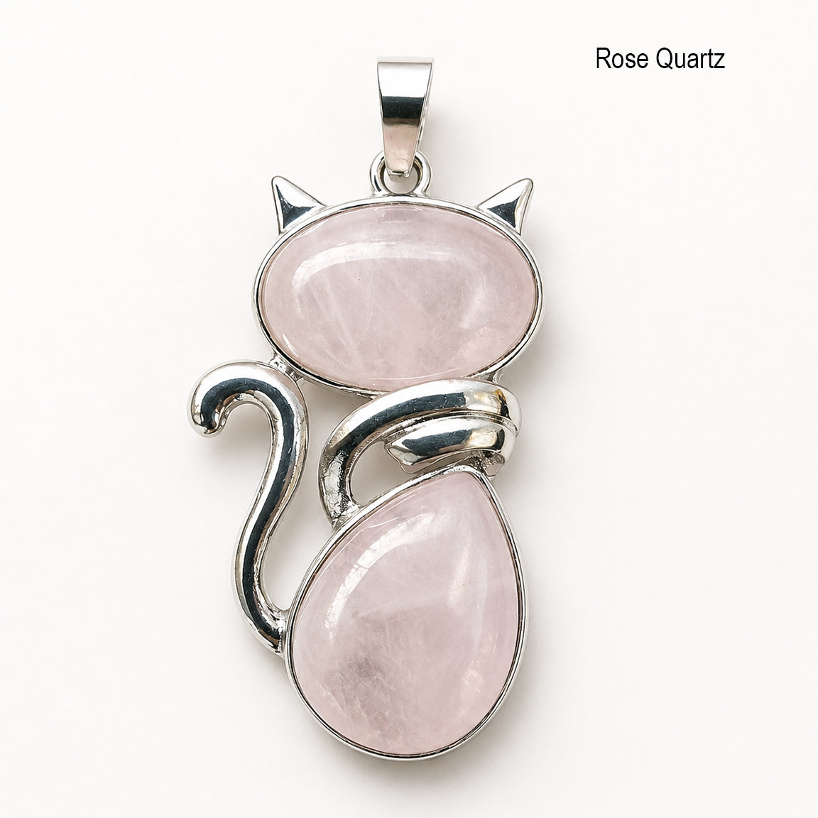 Cat-shaped pendant with rose quartz stones on a white background