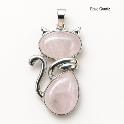 Cat-shaped pendant with rose quartz stones on a white background