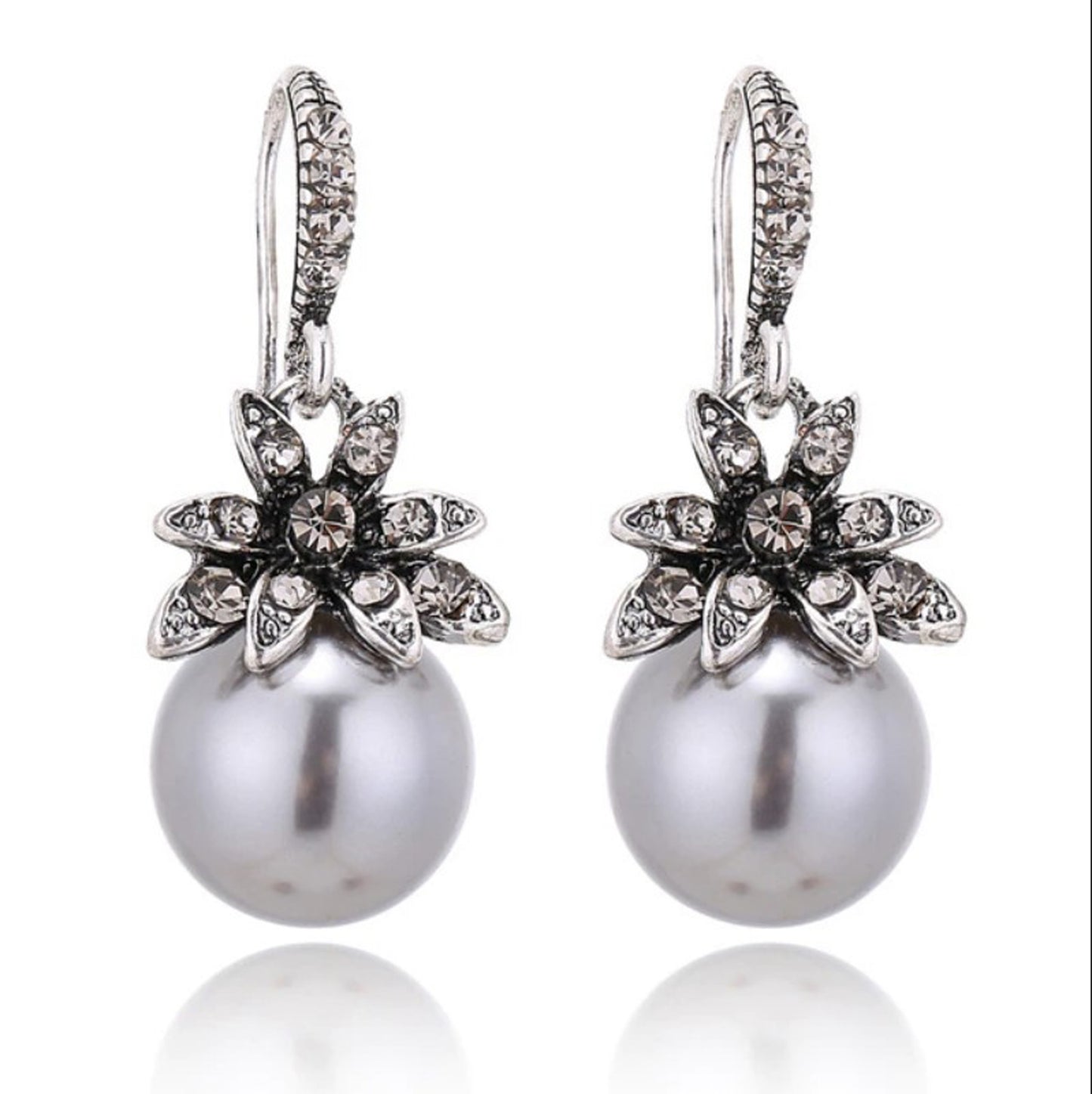 silver pearl drop earrings with rhinestone flowers with white background