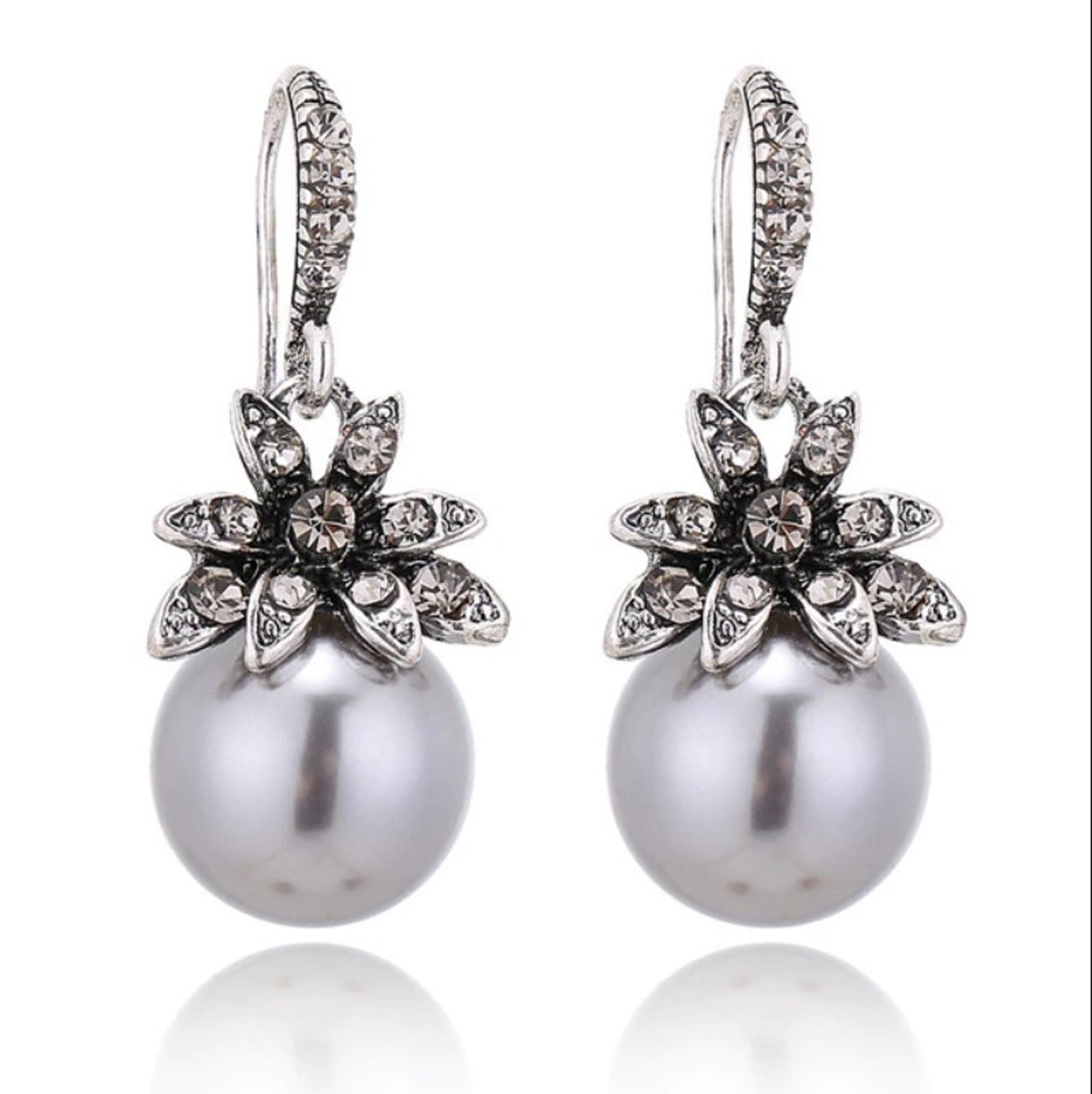 silver pearl drop earrings with rhinestone flowers with white background