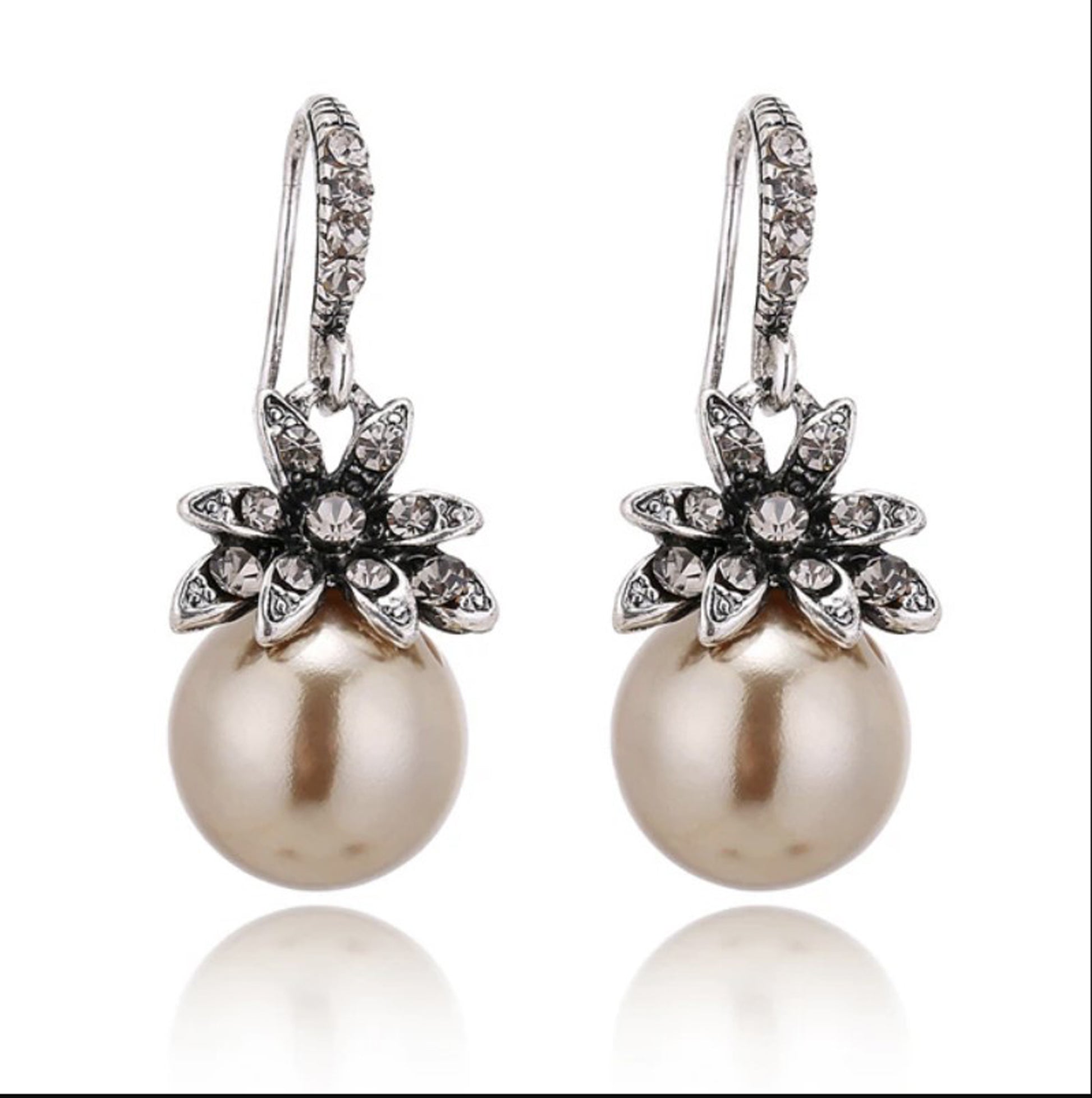 gold pearl drop earrings with rhinestone flowers with white background