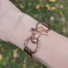 Rustic Western Copper Horse Head and Horseshoe Bracelet with leather straps on wrist outdoors