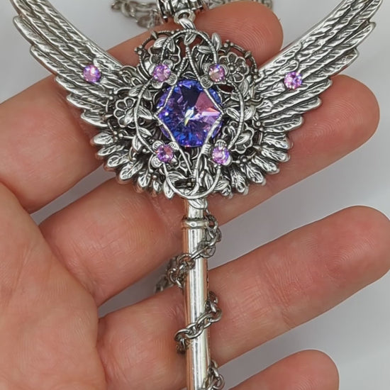 Fantasy floral sterling silver key necklace with wings made with Swarovski crystals.  Fairy jewelry.