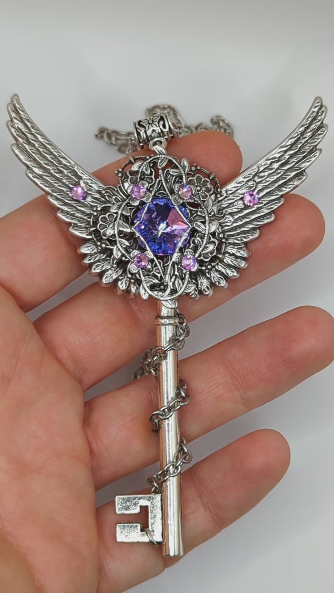 Fantasy floral sterling silver key necklace with wings made with Swarovski crystals.  Fairy jewelry.