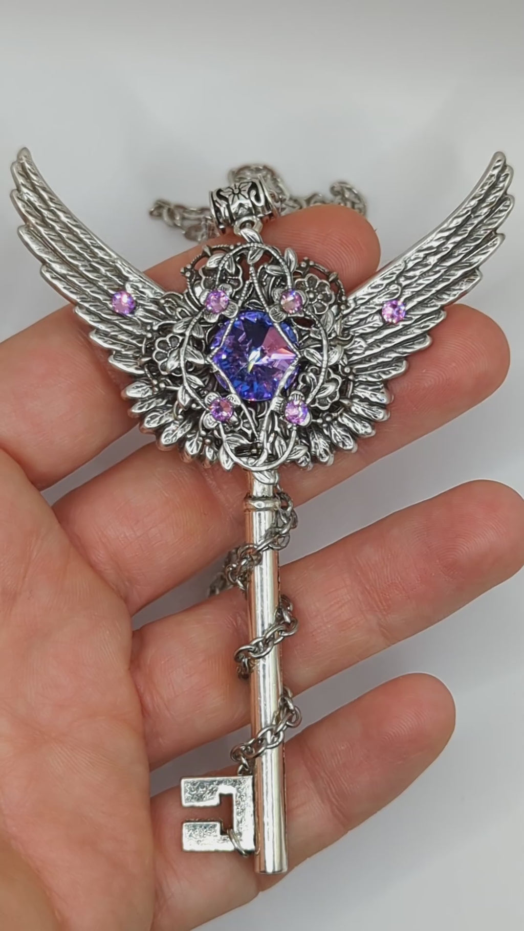 Fantasy floral sterling silver key necklace with wings made with Swarovski crystals.  Fairy jewelry.