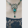 Video of Romantic brass jewelry set featuring cherub pendant necklace and coordinating earrings with green Swarovski accents