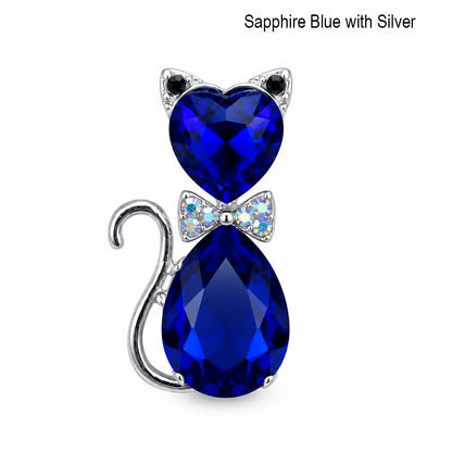 Sapphire blue crystal cat-shaped pendant with silver accents on a white background.  Cat jewelry