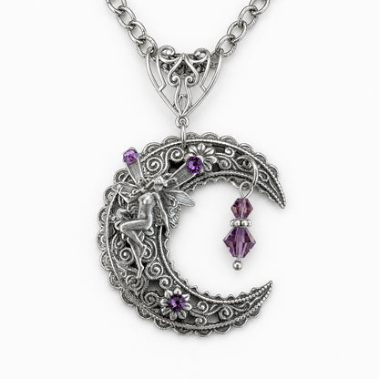An ornate silver filigree crescent moon pendant necklace featuring a fairy figure, small purple crystal flowers, and a dangling purple crystal charm, shown on a white background.