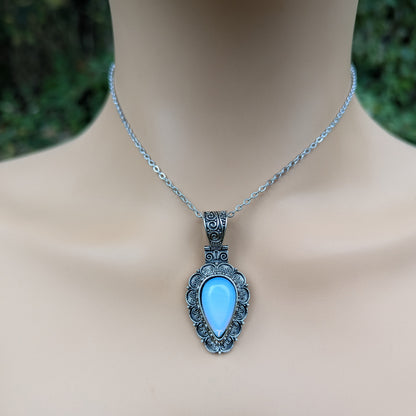 Necklace with a blue moonstone pendant on a model