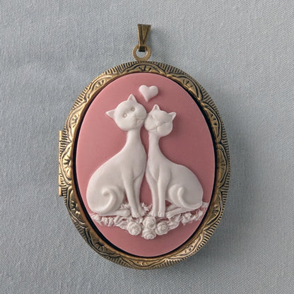Pink and white cat lovers cameo necklace on bronze locket.