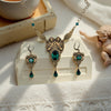 Romantic brass jewelry set featuring cherub pendant necklace and coordinating earrings with green Swarovski accents